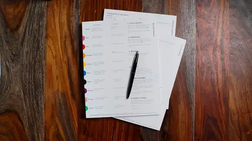 Printed statements and a pen on a wooden desk